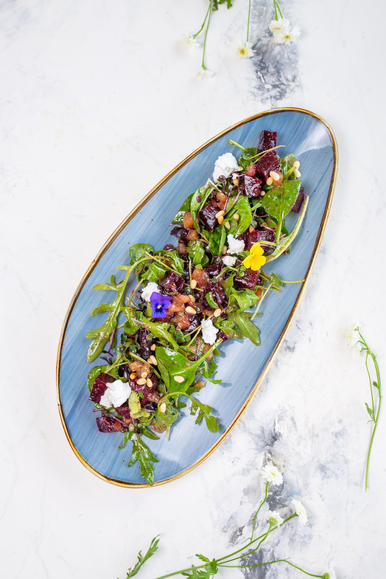 Plated seasonal salad with edible flowers